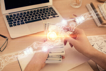 Multi exposure of technology drawing hologram and us dollars bills and man hands. Data concept
