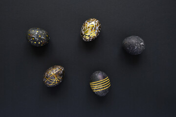 Black easter eggs with gold pattern on black