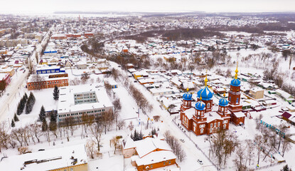 Aerial view of snow covered Petrovsk cityscape with Church of Intercession of Holy Virgin in winter, Saratov region, Russia.