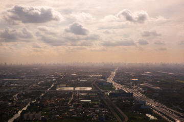 Aerial view landscape of Bangkok from the plane in fog with clouds, Thailand.