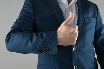 man in suit thumbs up