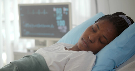 Close up of afro-american patient lying in hospital bed and losing consciousness