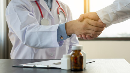 The doctor's hand shook the patient's hand, giving him support and protection, and in gratitude.