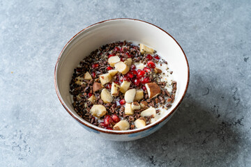 Healty Oatmeal Porridge with Brazil nuts, Cacao Chocolate Nibs, Pomegranate and Chia Seeds.