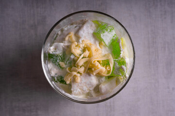 coconut with pandan flavored geltain with cheese on top