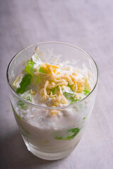 coconut with pandan flavored geltain with cheese on top