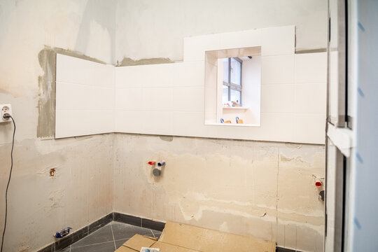 Bathroom renovation, tile laying, wall filling
