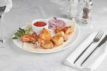 Grilled meat on a plate, serving in a restaurant