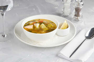 Mediterranean cuisine, salmon fish soup, restaurant serving