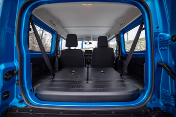 open car trunk with seats folded into flat flor of suv crossover