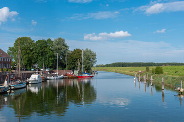 Sailboats in the old harbor of Hooksiel