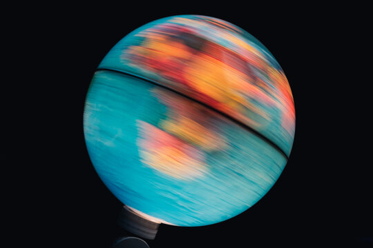 Illuminated World Globe Spinning With Black Background