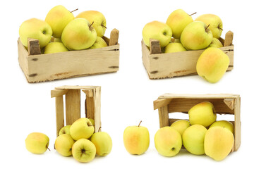 fresh yellow apples in a wooden crate  on a white background