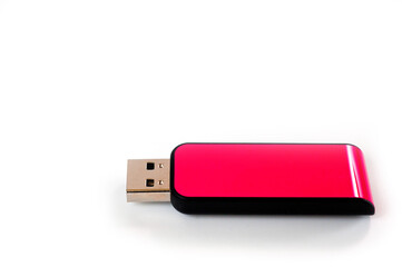 A pink USB flash drive with a plastic case, shot against a white background.