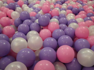 children are playing in the colorful ball pool for fun at holiday design for the happy and joyful concept