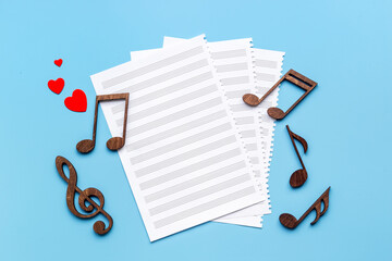 Musical wooden notes on music sheet. Top view