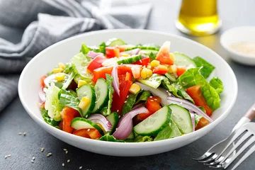 Foto op Canvas Vegetarian fresh vegetable organic salad with cucumber, red bell pepper, red onion, corn and green lettuce © Sea Wave