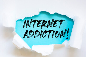 Internet Addiction written under torn paper.