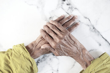 close up of hand of a elderly person isolated on white 