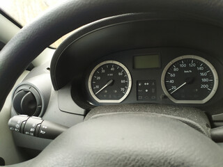 Close-up view in car dashboard with instruments of measurement in car cockpit with instrument panel for speeding and speedometer, tachometer and rpm indicators for safe mobility in motorized sport car