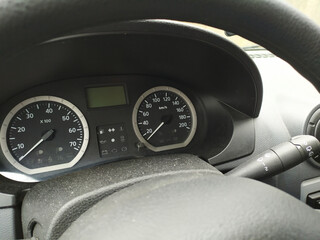 Close-up view in car dashboard with instruments of measurement in car cockpit with instrument panel...