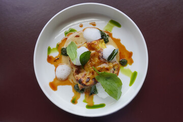 Confit duck cannelloni, duck juice with spinach.