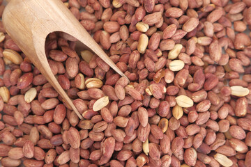 Processed pea nuts in a bowl on table top down .