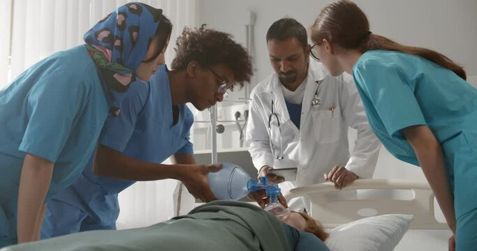 Young future doctors learning to reanimate patient in emergency department