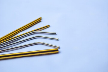 stainless straw on light blue background