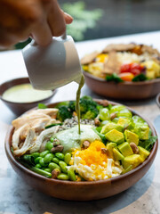 Cafe - Salad bowl with variety of vegetable, beans, salad cream
