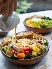 Cafe - Salad bowl with variety of vegetable, beans, salad cream