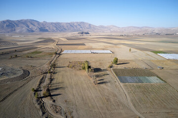 Mountain valley with farmlands in Turkey. Aerial panoramic view.