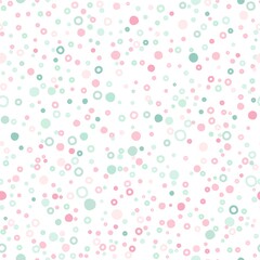 Seamless abstract pattern of little circles of pink and green pastel colors.