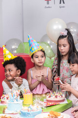 Group of  happy and enjoy kids have fun celebrating her birthday with Multinational friend kids birthday celebratiion party.