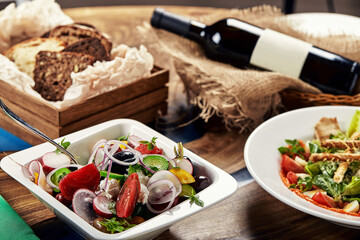 Classic Greek salad. Banquet festive dishes. Gourmet restaurant menu. White background.