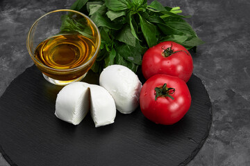 Fresh handmade soft Italian cheese from Campania, white balls of buffalo mozzarella cheese made from cow milk ready to eat close up