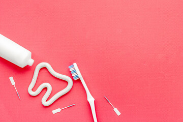 Oral care products flat lay. Toothbrushes with white tube of toothpaste and dental floss