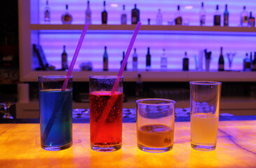 Bright drinks in different colors on the bar. The concept of a pleasant time spent and memorable experiences