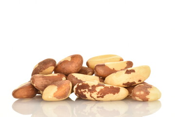 Several ripe organic Brazil nuts, close-up, isolated on white.