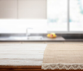 Napkin on wooden desk perspective. Kitchen background.