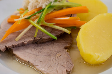 Stewed Pork with Root Vegetable Julienne of Carrots, Leeks, Horseradish and Potatoes called Steirisches Wurzelfleisch in Austria Close Up