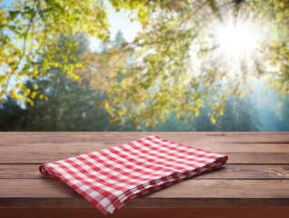 Napkin. Tablecloth tartan, checkered, dish towels on wooden table perspective. Landscape background.