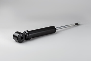 Trucks Cabin Shock Absorber, New auto parts, spare parts Cabinedemper. Shock absorber on a gray background.
