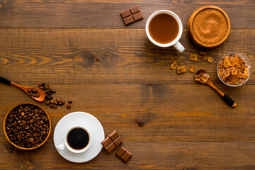Coffee and cocoa beans and ground powder with hot chocolate drink