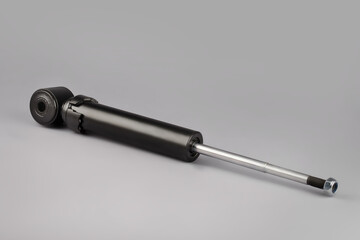 Trucks Cabin Shock Absorber, New auto parts, spare parts Cabinedemper. Shock absorber on a gray background.