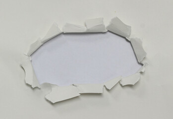 Torn hole in paper texture, copy space for advertising message.