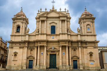 Fototapeta na wymiar Facade of Roman Catholic cathedral in historic part of Noto city, Sicily in Italy