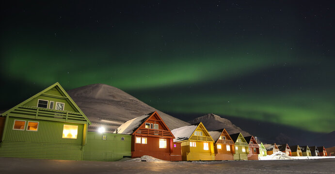 Northern Lights Over The Iconic Svalbard Houses