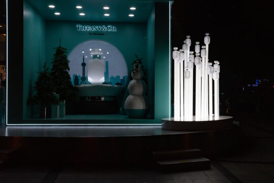 Tiffany Christmas outdoor decorations in night. Huge illuminated gift box with place to take photo and make selfie. Winter holiday in Shanghai, China, 12 05 2019