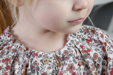 Close up portrait of toddler girl's mouth nose and neck
